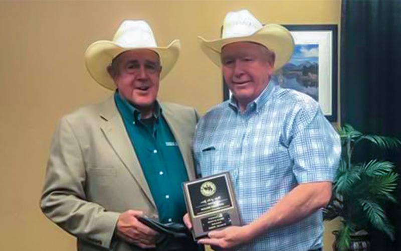 Photo: (l-r) SWTJC Rodeo Coach Roy Angermiller (left) accepts the award for Rodeo of the Year in the Southern Region from Roger Walters, (right) National Intercollegiate Rodeo Association Commissioner in Casper Wyoming.